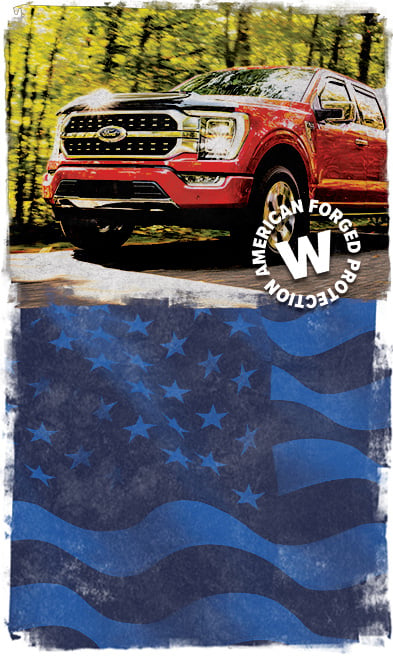 ford f-150 driving through woods next to American flag