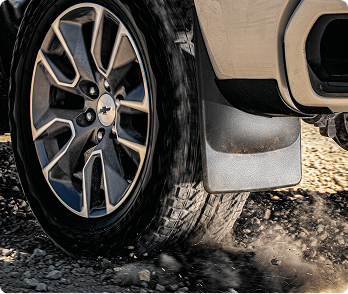 WeatherTech MudFlap installed on a vehicle.