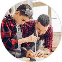 dad and son working with hand tools