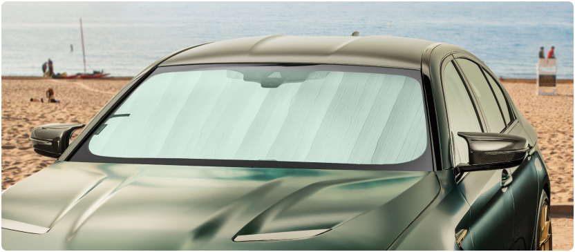 WeatherTech SunShade installed on vehicle with beach background