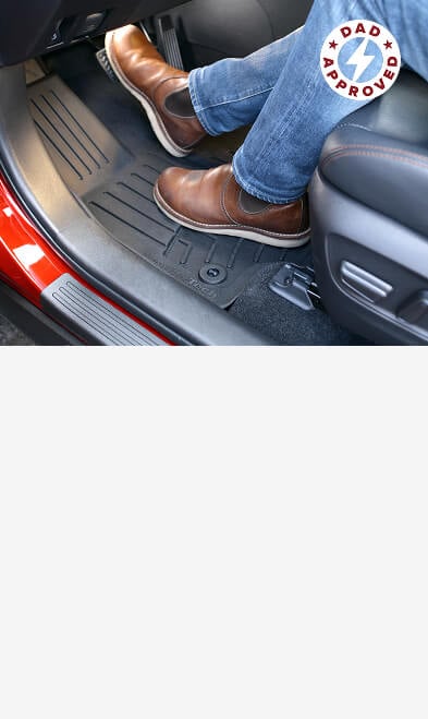 man's feet pressing a foot pedal in car with weathertech floorliners installed