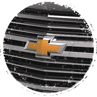 Chevrolet logo printed on the grill of a truck.