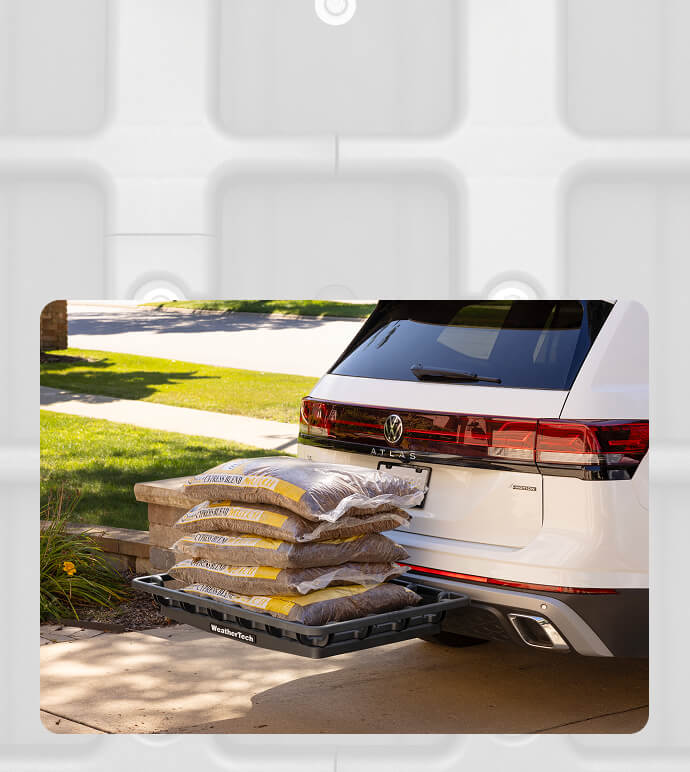weathertech hitch basket installed on suv carrynig bags of mulch