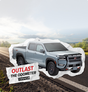 Truck near a mountain road with outlast the odometer paper cutout and image of odometer.
