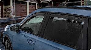 Image of a blue S U V in the rain