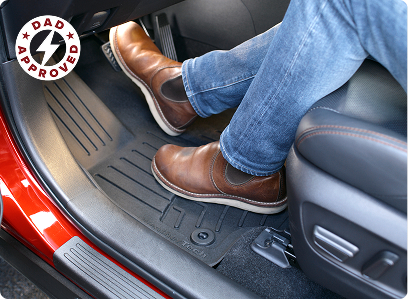 Man in boots resting feet on a WeatherTech floorliner HP