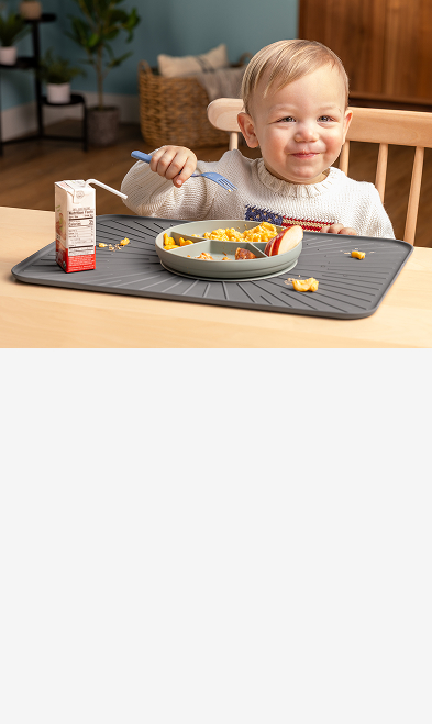 toddler boy eating meal on top of weathertech bratmat