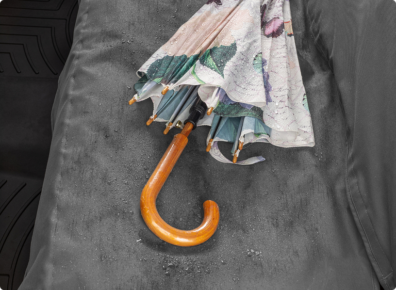 A Wet Umbrella Atop a WeatherTech Seat Protector